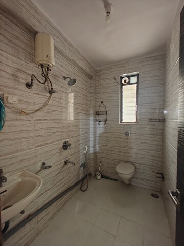 Bathroom in 3 BHK Apartment at Seawoods Sector 50 – for Rent