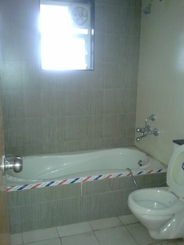 Bathroom in 3 BHK Apartment at Divyasree Elan, Sarjapur – for Rent