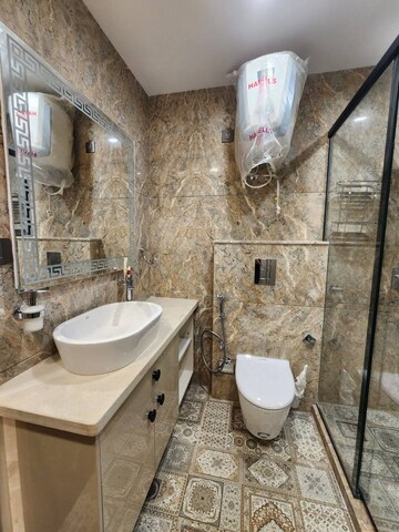 Bathroom in 4 BHK Builder Floor at Ansal API Esencia, Sector 67 – for Sale
