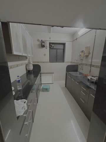 Kitchen in 2 BHK Apartment at Nirmal Jeevan CHS, Kopri – for Rent