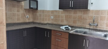 Kitchen in 2 BHK Apartment at Amrapali Eden Park, Sector 50 – for Rent