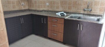 Kitchen in 2 BHK Apartment at Amrapali Eden Park, Sector 50 – for Rent