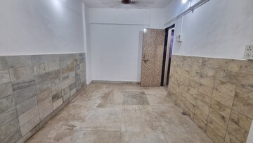 Living Room in 1 BHK Apartment at Rishikesh CHS, Malad West – for Rent