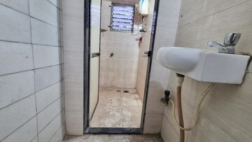 Bathroom in 1 BHK Apartment at Rishikesh CHS, Malad West – for Rent