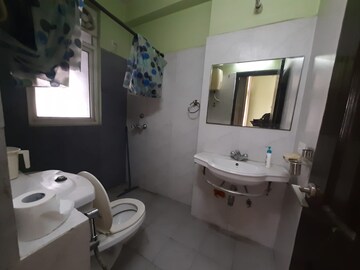 Bathroom in 4 BHK Apartment at Ramprastha Greens, Vaishali Sector 7 – for Rent