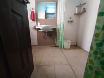 Bathroom in 4 BHK Apartment at Ramprastha Greens, Vaishali Sector 7 – for Rent