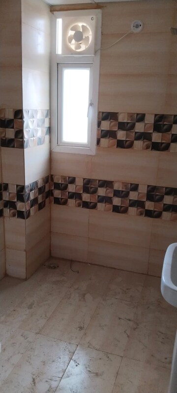 Bathroom in 4 BHK Apartment at Uninav Bliss, Raj Nagar Extension – for Rent