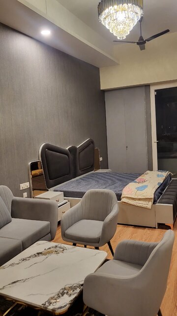 Living Room in Studio Apartment at Gaur City Mall, Sector 4 Greater Noida – for Rent