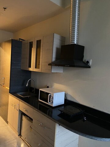 Kitchen in Studio Apartment at Gaur City Mall, Sector 4 Greater Noida – for Rent