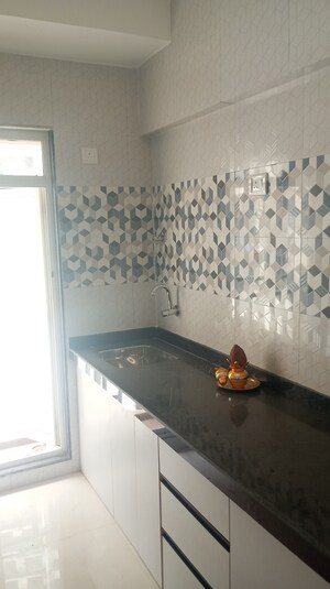 Kitchen in 1 BHK Apartment at Raunak Bliss, Ghodbunder Road – for Sale