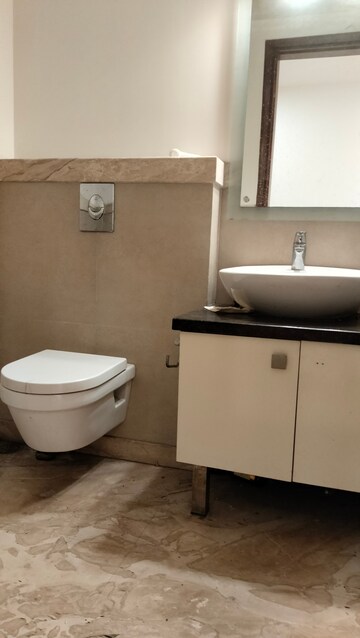 Bathroom in 4 BHK Apartment at Vasant Vihar – for Sale