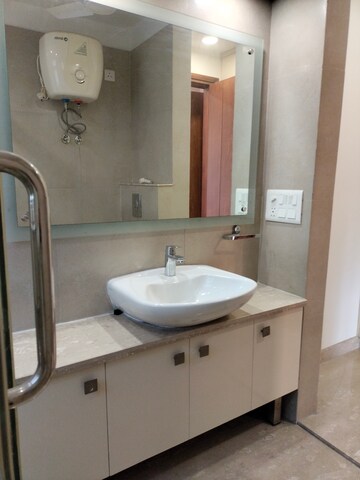 Bathroom in 4 BHK Apartment at Vasant Vihar – for Sale