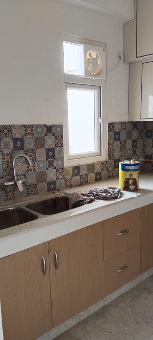 Kitchen in 3.5 BHK Apartment at Uninav Eden, Raj Nagar Extension – for Sale