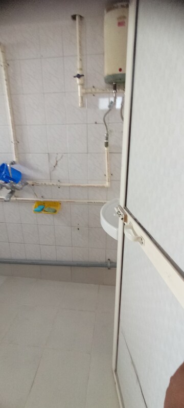 Bathroom in 2 BHK Apartment at Charkop Priya CHS, Kandivali West – for Rent