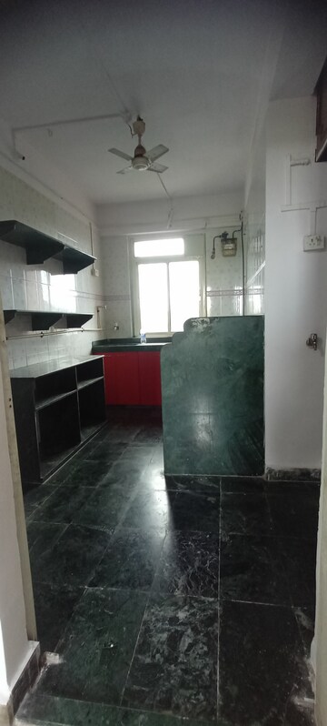 Kitchen in 2 BHK Apartment at Charkop Priya CHS, Kandivali West – for Rent