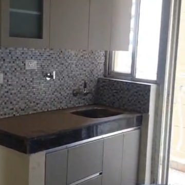 Kitchen in 2 BHK Apartment at Sikka Kaamna Greens, Sector 143 – for Rent