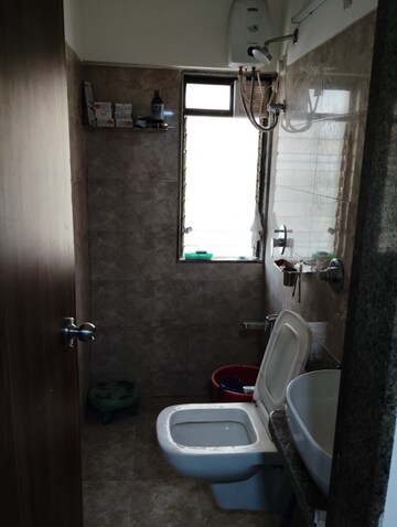 Bathroom in 1 BHK Apartment at Parinee Essence, Kandivali West – for Rent