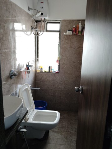 Bathroom in 1 BHK Apartment at Parinee Essence, Kandivali West – for Rent