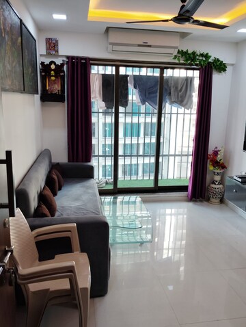 Living Room in 1 BHK Apartment at Parinee Essence, Kandivali West – for Rent
