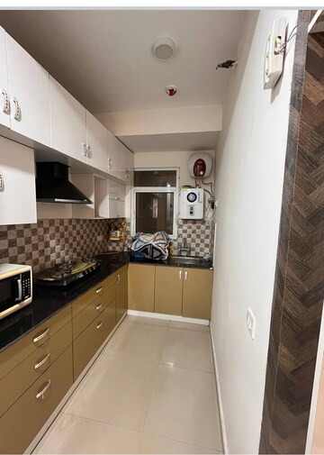 Kitchen in 2 BHK Apartment at Panchsheel Greens II, Sector 16 Greater Noida – for Rent