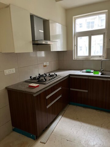 Kitchen in 3 BHK Apartment at Puri Anand Villas Phase II, Sector 81 – for Rent