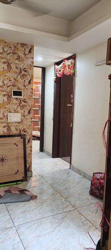 Living Room in 2 BHK Apartment at Arocon Golf Ville, Sain Vihar – for Rent