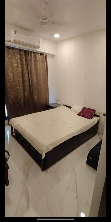 Bedroom in 2 BHK Apartment at Dev Leo Tower, Oshiwara – for Rent