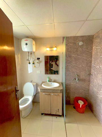 Bathroom in 1 RK Apartment at Nimbus The Golden Palm, Sector 168 – for Sale