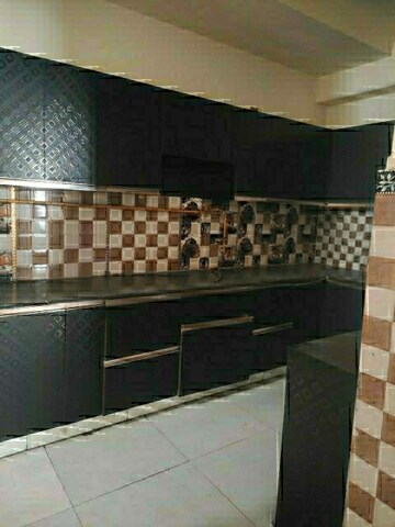 Kitchen in 4 BHK Apartment at Ramprastha Coral Heights, Ramprastha Greens – for Sale