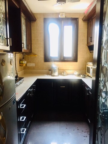 Kitchen in 3 BHK Apartment at Panchsheel Enclave – for Rent
