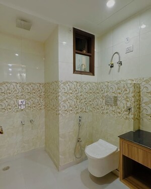 Bathroom in 3 BHK Apartment at Mahavir Enclave 1 – for Sale