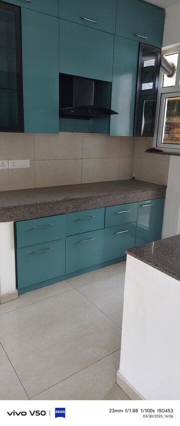 Kitchen in 2 BHK Apartment at Raheja Vedaanta, Sector 108 – for Rent