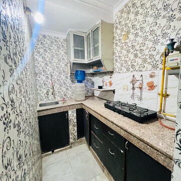 Kitchen in 2 BHK Builder Floor at Khirki Extension – for Rent