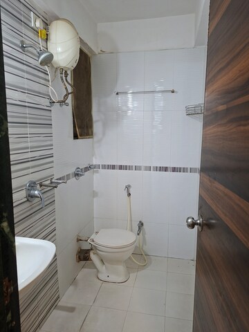 Bathroom in 2 BHK Apartment at Mahavir Kalpavruksha, Ghodbunder Road – for Rent