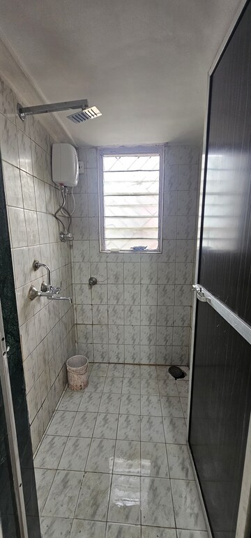 Bathroom in 1 BHK Apartment at Asmita Jyoti CHS, Malad West – for Rent