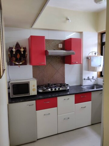 Kitchen in 2 BHK Apartment at Puranik Hometown, Ghodbunder Road – for Rent