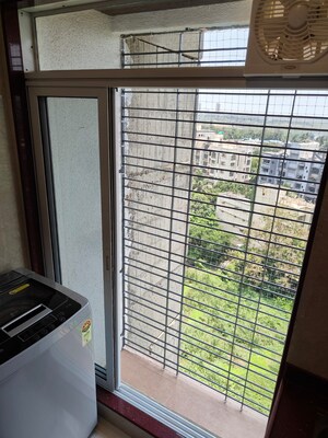 Balcony in 2 BHK Apartment at Sangam Charkop Akash Kiran CHS, Charkop Sector 2 – for Sale