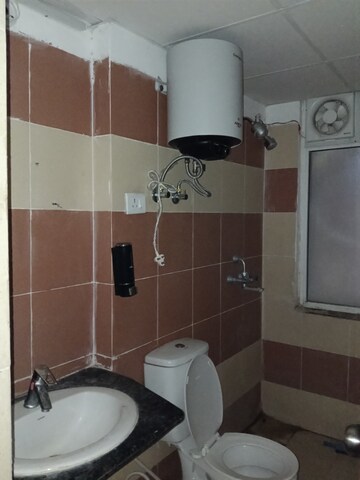 Bathroom in 3 BHK Apartment at JKG Palm Court, Sector 16c Greater Noida – for Rent