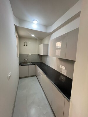 Kitchen in 1 BHK Apartment at Chattarpur – for Sale