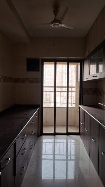 Kitchen in 2 BHK Apartment at Varun Garden, Ghodbunder Road – for Rent