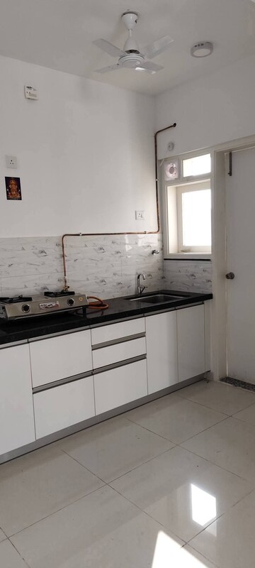 Kitchen in 2 BHK Apartment at Amanora Gold Towers, Hadapsar – for Rent