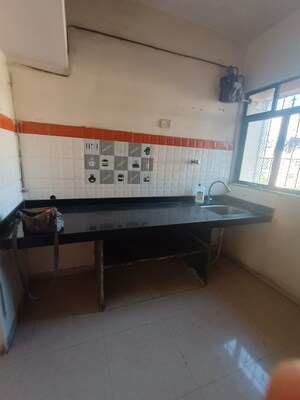 Kitchen in 1 BHK Apartment at Highland Residency CHSL, Balkum Pada – for Sale