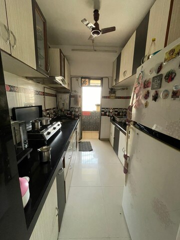 Kitchen in 2 BHK Apartment at Maharaja Retreat CHS, Goregaon East – for Rent