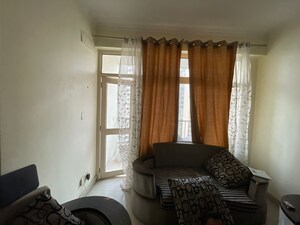 Living Room in 2 BHK Apartment at Supertech Livingston, Sain Vihar – for Rent