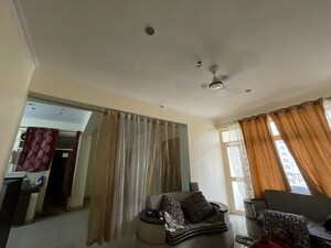 Living Room in 2 BHK Apartment at Supertech Livingston, Sain Vihar – for Rent