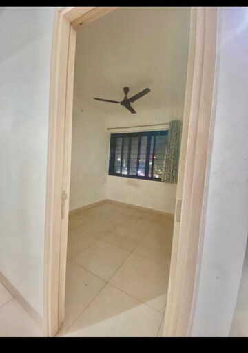 Living Room in 2 BHK Apartment at Windsor Maple Woodz, Wagholi – for Rent