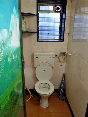 Bathroom in 1 BHK Apartment at Namo Shanti Dham CHS, Borivali West – for Rent