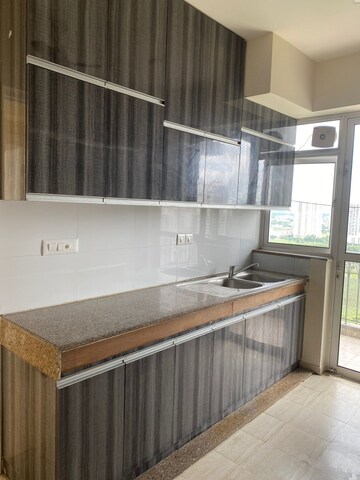 Kitchen in 4 BHK Apartment at DLF Regal Gardens, Sector 90 – for Rent