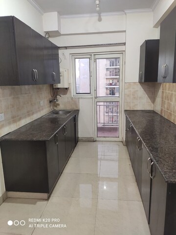Kitchen in 2 BHK Apartment at Aims Golf City, Sector 75 – for Rent