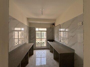 Kitchen in 1.5 BHK Apartment at Paradigm El Signora, Jogeshwari West – for Sale